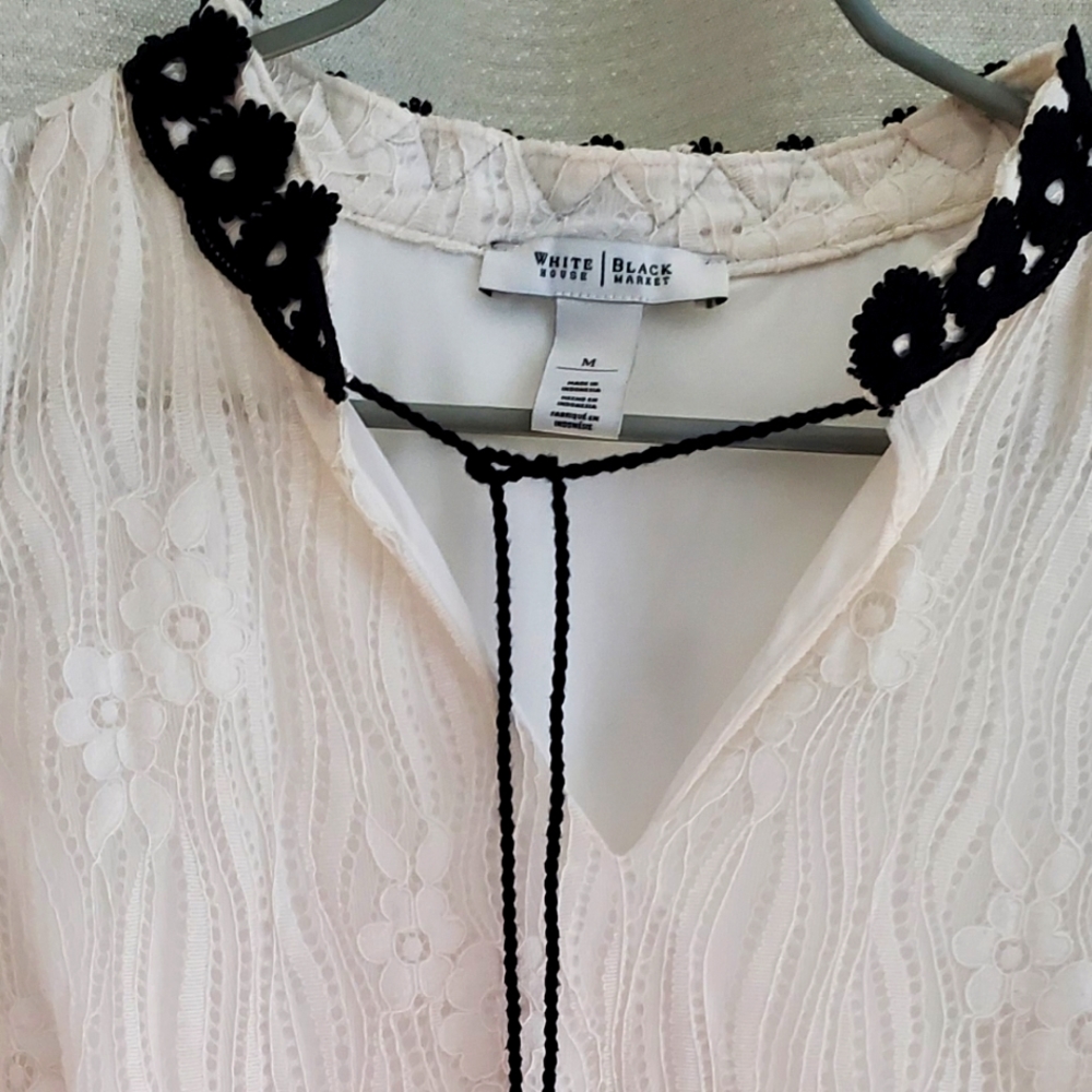 Sleeveless fully lined lace top with black trim